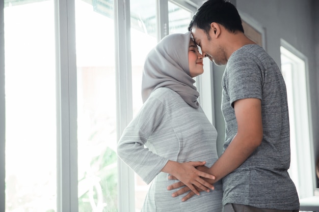 Muslim pregnant woman with her husband