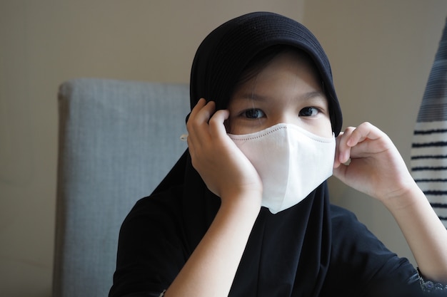 Muslim School kid self isolation,stay home with mask