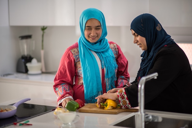 Muslim traditional woman working in kitchen