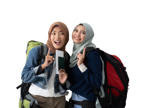 Muslim woman backpacker holding passport