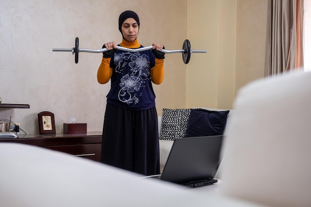 muslim woman doing exercises in home