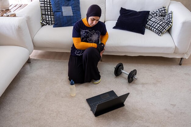 muslim woman doing exercises in home