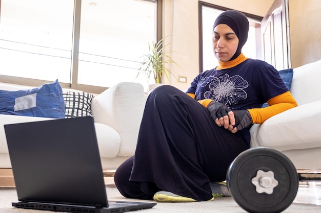 muslim woman doing exercises in home