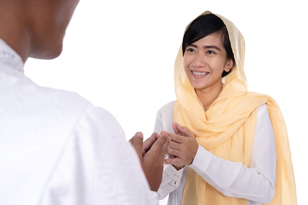 Muslim woman hand touching shake hand