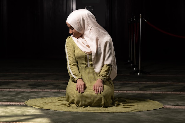 Muslim Woman Praying at the Mosque