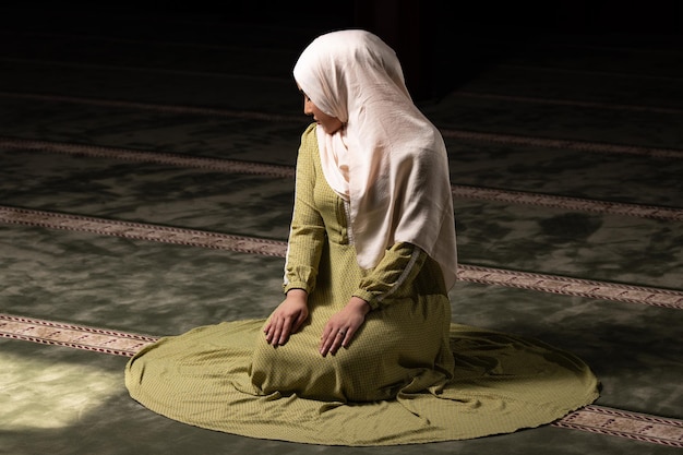 Muslim Woman Praying at the Mosque