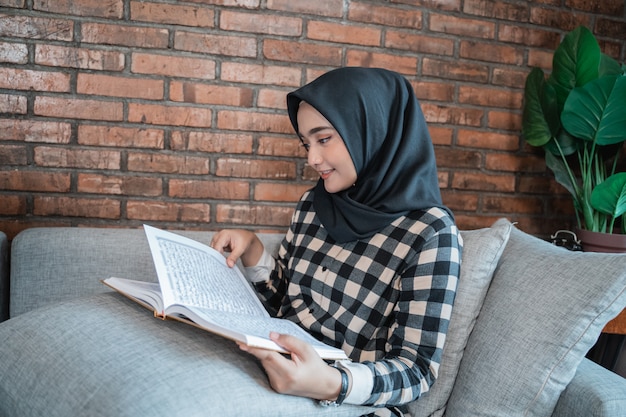 Muslim woman reading Quran