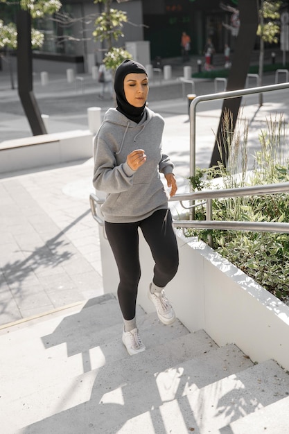 Muslim woman running on morning outdoor workout