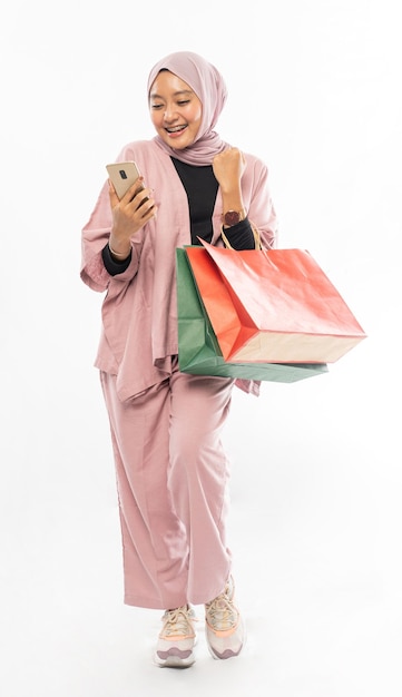 Muslim woman shopping hold mobile phone or smartphone