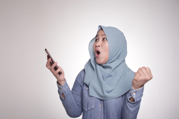 Muslim Woman Surprised to See Something Above when using Phone