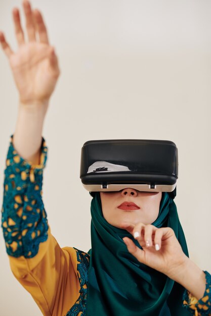 Muslim woman in vr headset