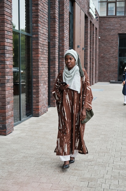 Muslim woman walking outdoors