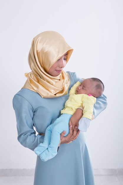 Muslim woman with her baby