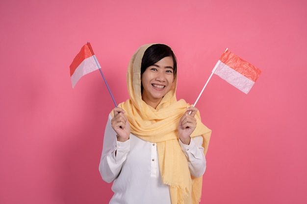 Muslim woman with indonesia national flag