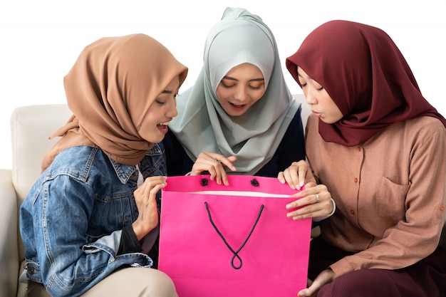 Muslim woman with shopping bag isolated