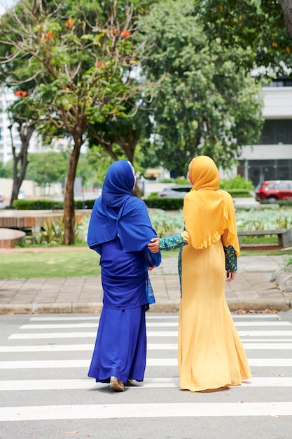 Muslim women crossing road