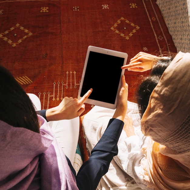 Muslim women using tablet