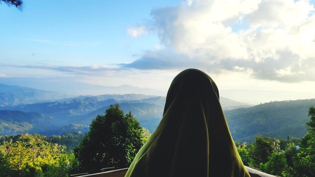 Muslim womens silhouettes stare at the mountain scenery in the morning