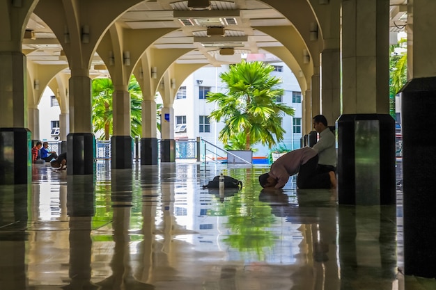 Muslims Men praying and prostrate