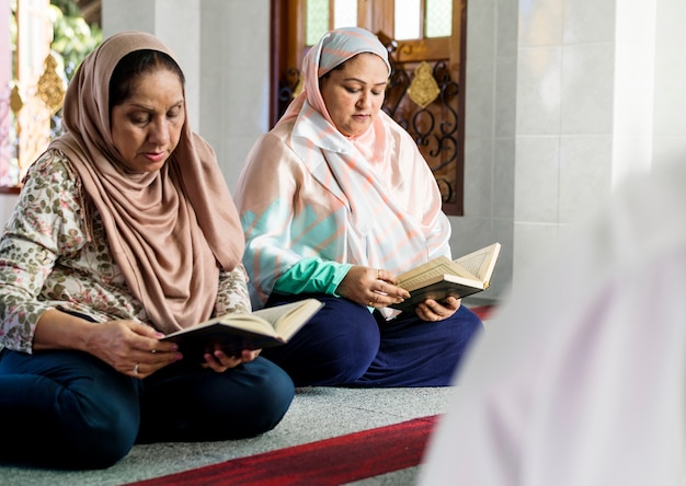 Muslims reading from the quran