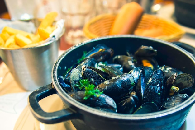 The mussels in the pan.