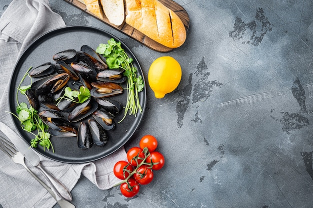 Mussels stew in white wine and herbs top view flat lay