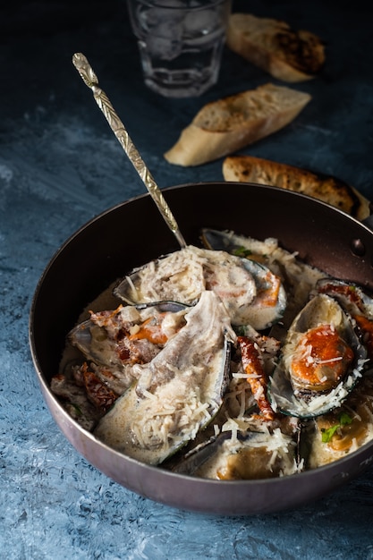 Mussels with Blue Cheese Sauce and Garlic Baguette.