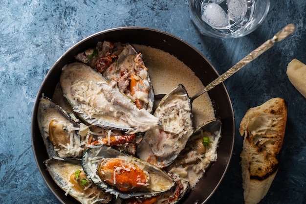 Mussels with Blue Cheese Sauce and Garlic Baguette.