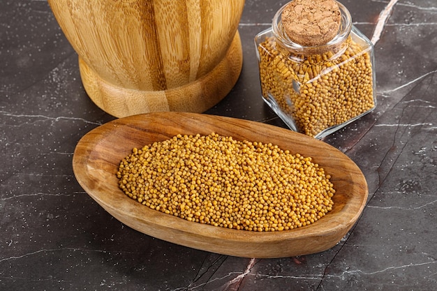 Mustard dry seeds in the bowl for cooking