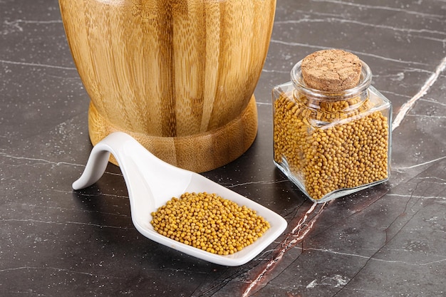 Mustard dry seeds in the bowl for cooking