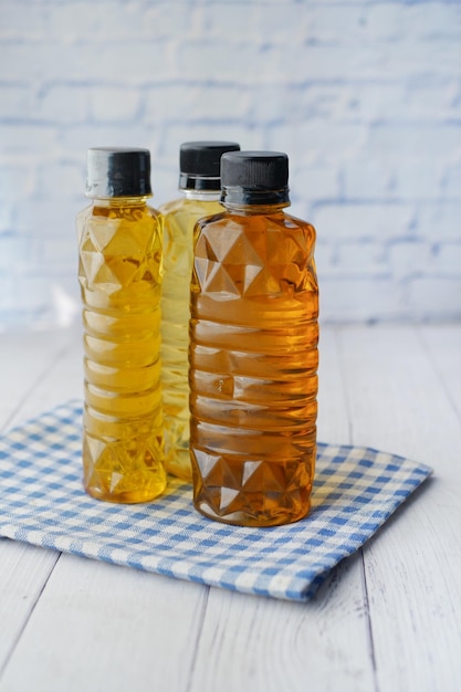 Mustard oil in a plastic jar on table