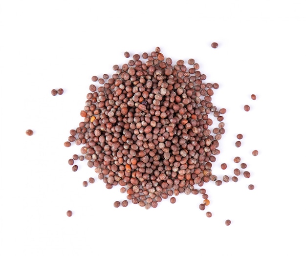 Mustard seeds on white table