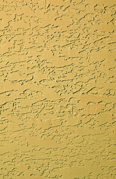 Mustard yellow colored abstract pattern concrete wall