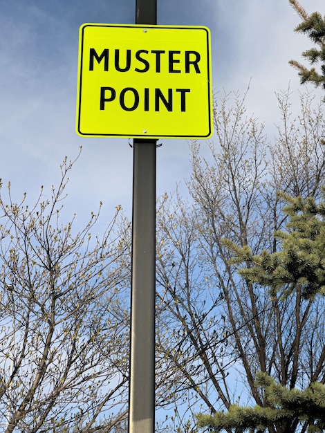 Photo muster point sign for people to meet during emergencies