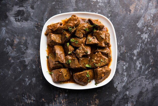 Mutton Liver fry or Kaleji masala, popular Non vegetarian recipe from India and Pakistan. served dry or with curry in a bowl, karahi or plate