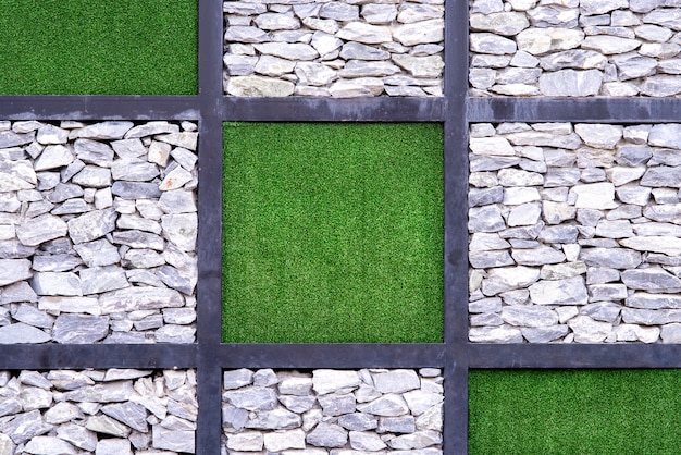 Muur met een verschil van steen en gras textuur in de vorm van vierkante rechthoek. Gebruik voor achtergrond