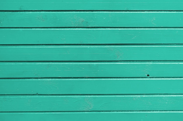 Muur van de planken geschilderd door groene olieverf.