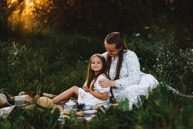 Photo my daughter is spending time outdoors and drinking tea