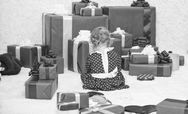 My first christmas Sharing joy of baby first christmas with family Baby first christmas once in lifetime event Gifts for child first christmas Little baby play near pile of wrapped red gift boxes