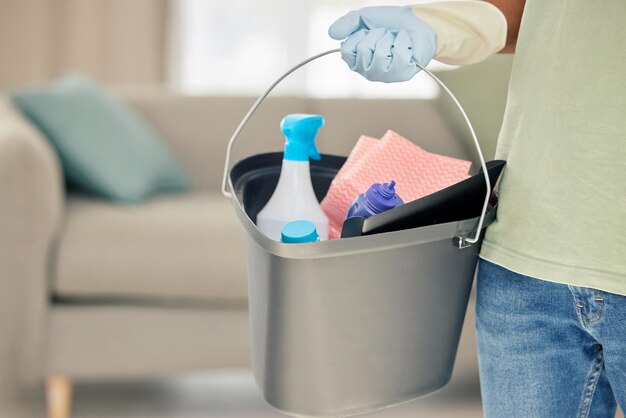 My home will be a bastion of cleanliness Shot of a man holding a bucket of cleaning supplies