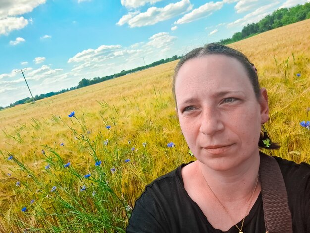 My portrait against the background of a wheat field