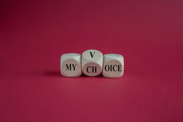 My voice and choice symbol Turned wooden cube and changes the concept word my choice to voice