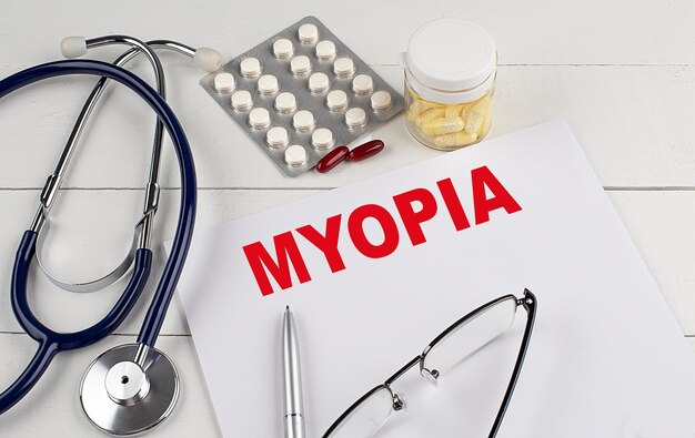 MYOPIA word on paper with stethoscope and pills