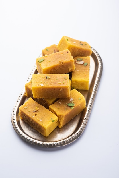 Mysore pak is an Indian sweet prepared in ghee. It originated in the city of Mysuru