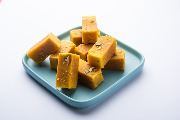 Mysore pak is an Indian sweet prepared in ghee. It originated in the city of Mysuru