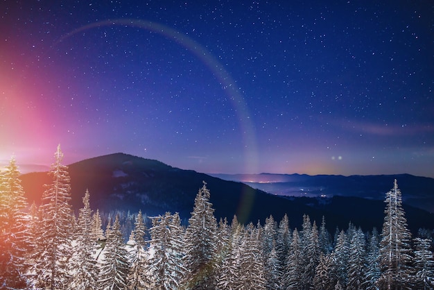 Mystical view of snowy hills in mountain valley