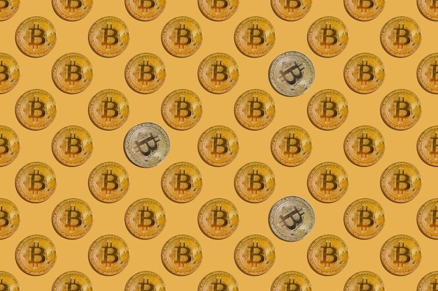 Naadloos patroon van virtueel geld bitcoin met zilveren spatten op gele achtergrond