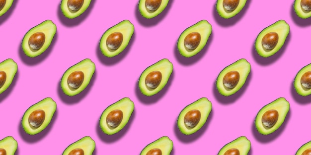Naadloze patroon van verse rijpe groene avocado geïsoleerd op roze background