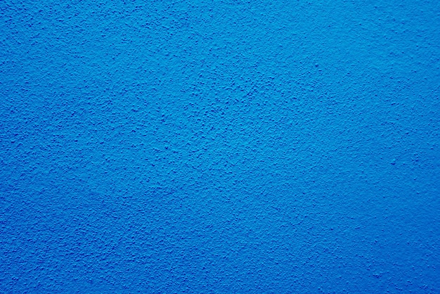 Naadloze textuur van blauwe cementmuur een ruw oppervlak met ruimte voor tekst voor een achtergrond