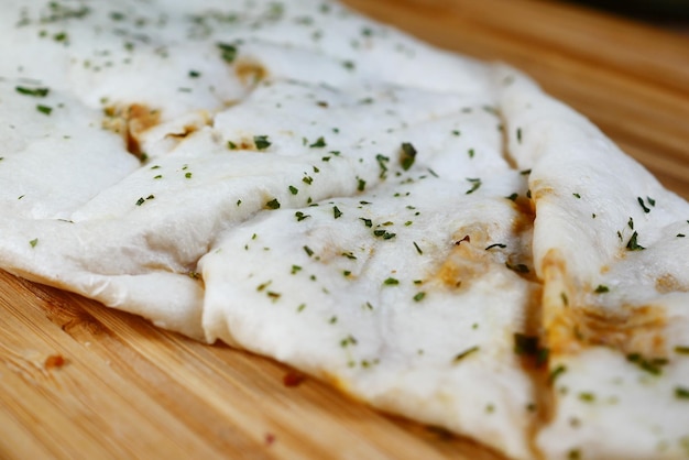 Naan bread on a wooden board